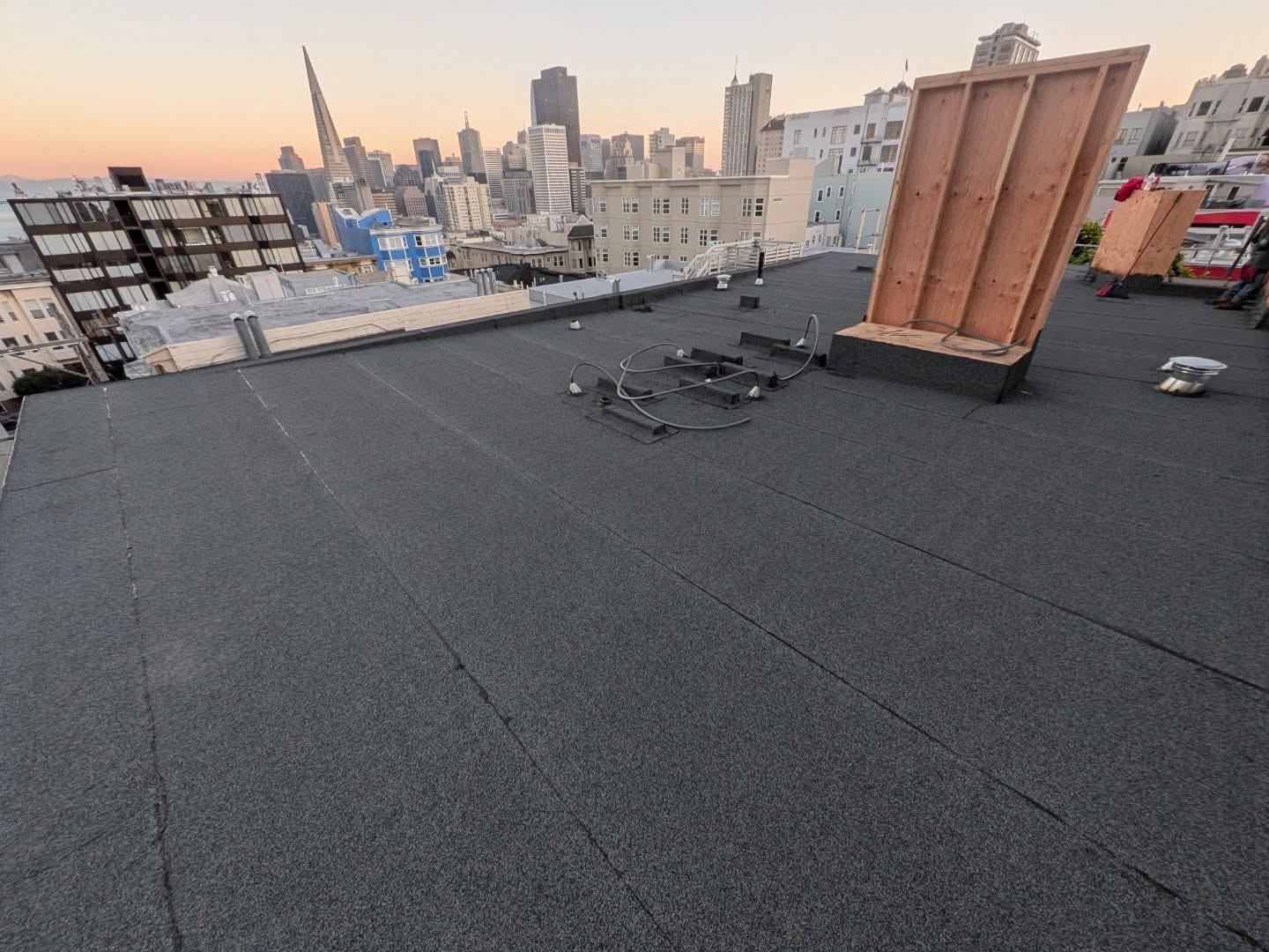 New flat roof installed by Golden Gate Roofing & Construction overlooking the San Francisco skyline
